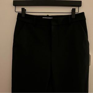 High-waisted trousers with rhinestone chain detail